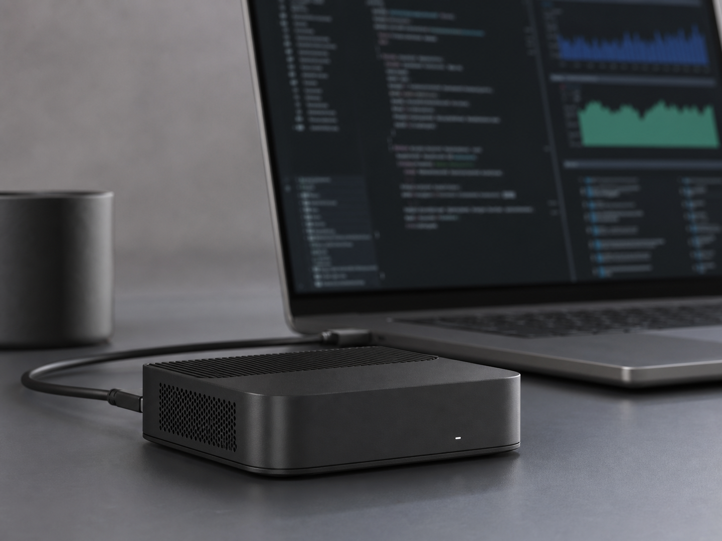 gpuvera terminal beside a laptop running a local model console and dashboard on a desk — concept render, pre-production.